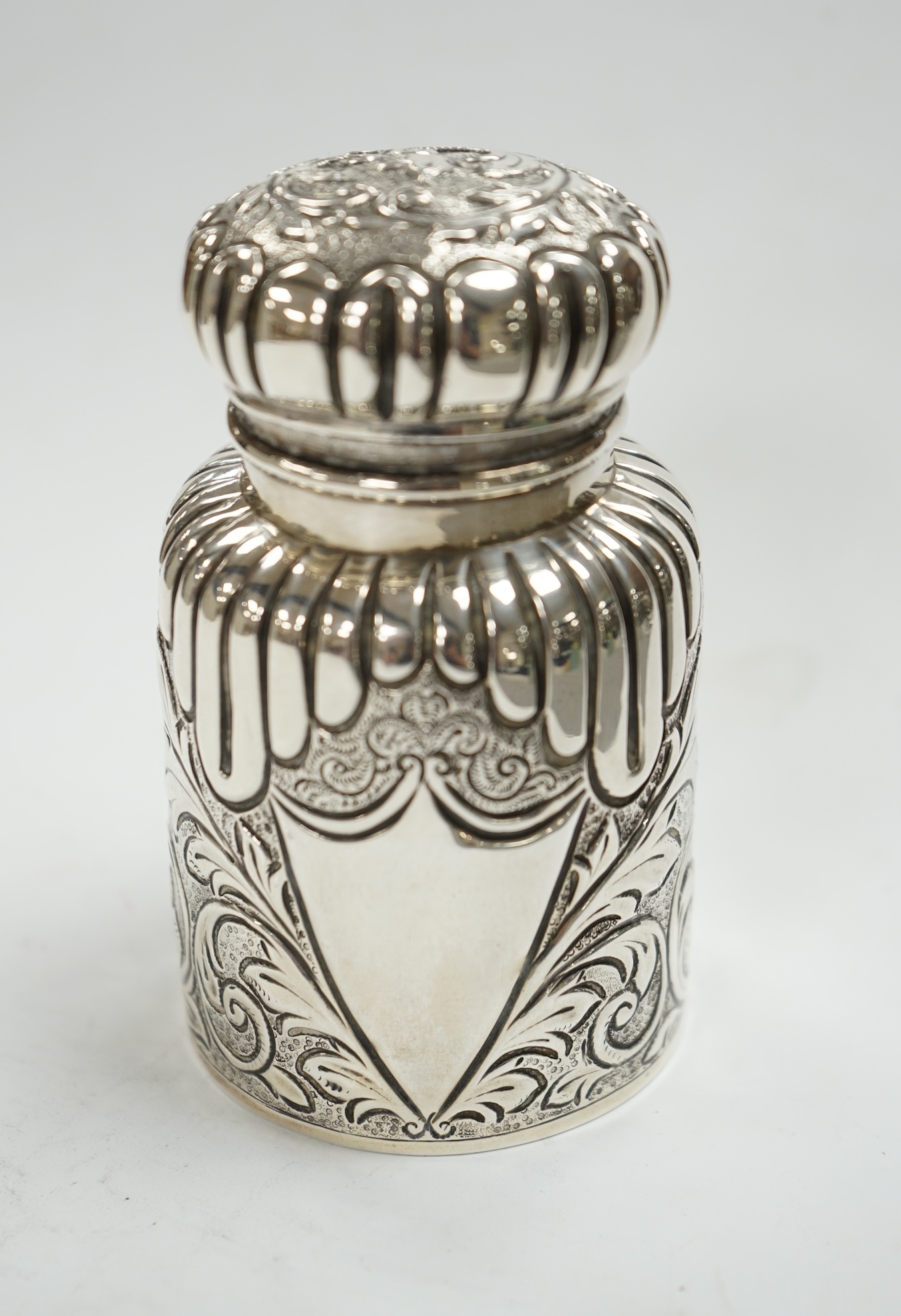 A late Victorian embossed silver scent bottle, by Arthur Wilmore Pennington, Birmingham, 1890, 95mm. Condition - poor to fair